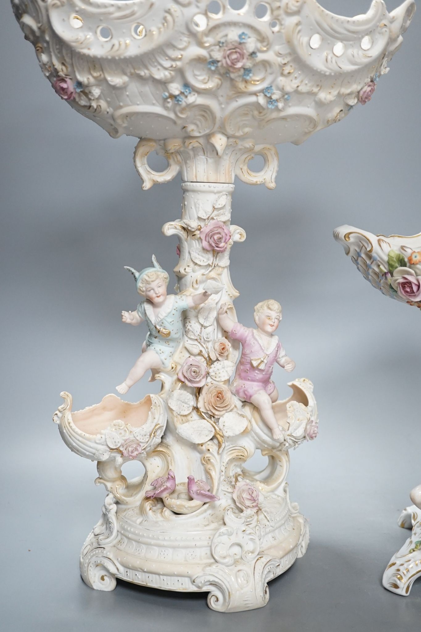 A French bisque centrepiece, Naples porcelain centrepiece and figural chariot, tallest 44cm